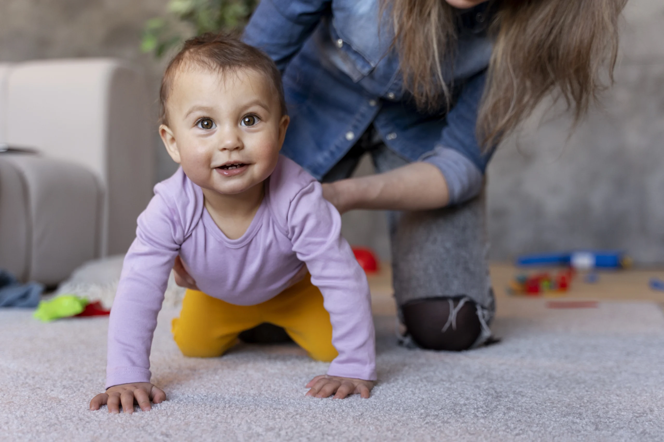 adorable-baby-crawling-floor-with-his-mother-s-help